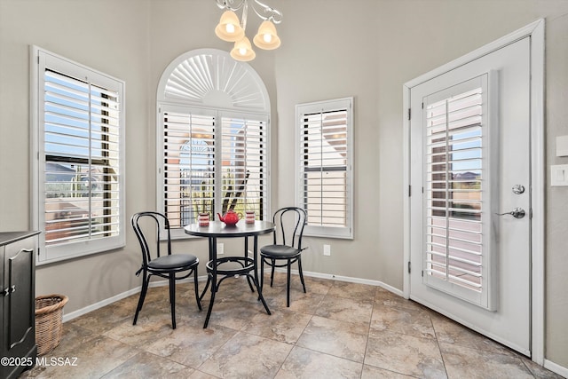 dining space with an inviting chandelier