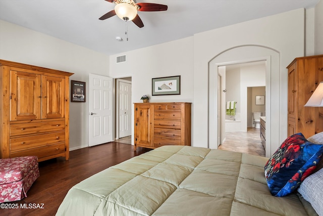 bedroom with ceiling fan and dark hardwood / wood-style flooring