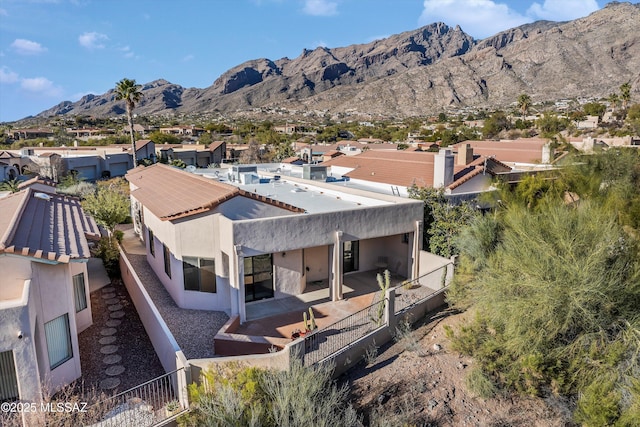 birds eye view of property with a mountain view