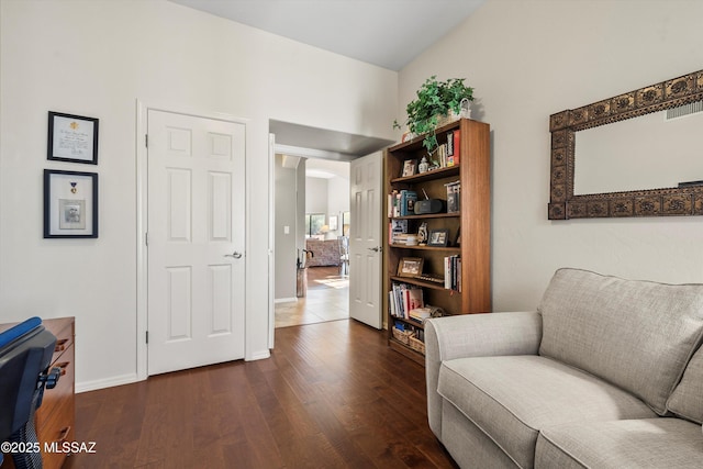 sitting room featuring dark wood-type flooring