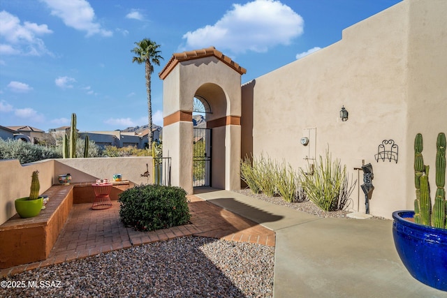 property entrance with a patio area