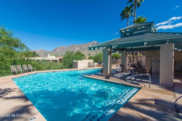 view of pool with a mountain view, a patio area, and a gazebo