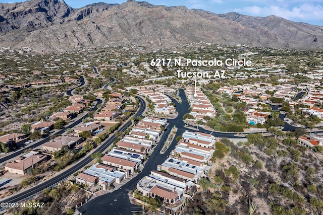 birds eye view of property featuring a mountain view