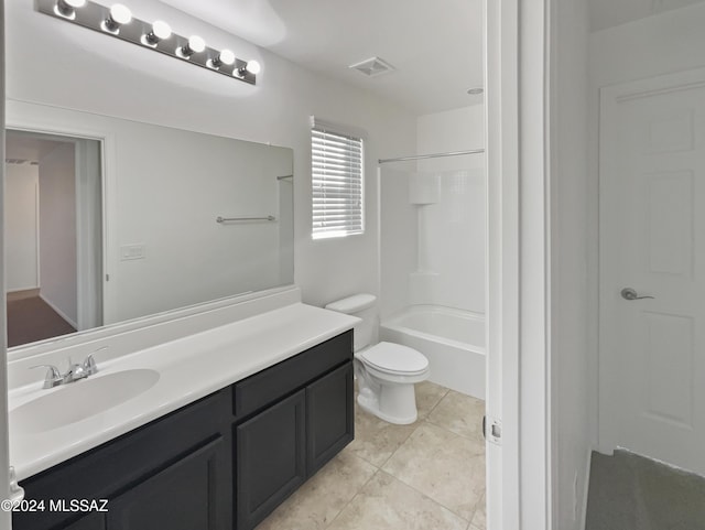 full bathroom with shower / bathing tub combination, tile patterned flooring, vanity, and toilet