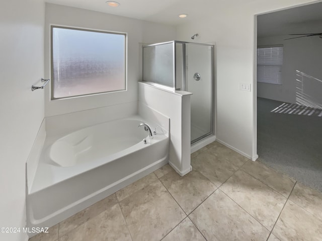 bathroom with tile patterned floors, ceiling fan, and shower with separate bathtub