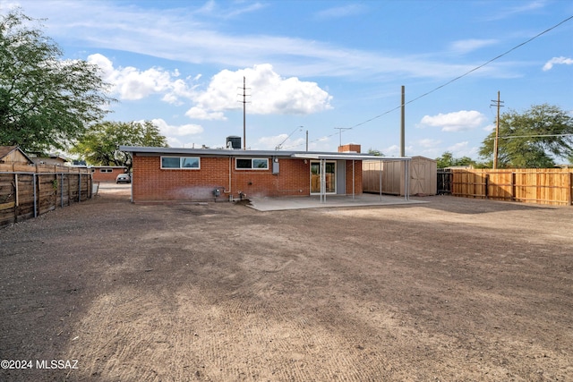 rear view of property featuring a patio area