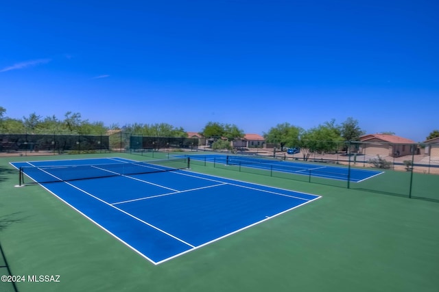 view of tennis court featuring basketball court