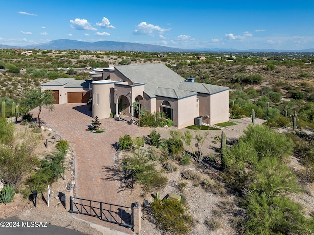 birds eye view of property featuring a mountain view