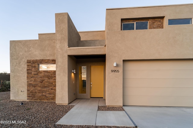 property entrance with a garage