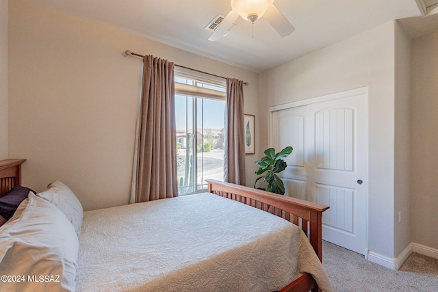 bedroom featuring carpet, a closet, and ceiling fan