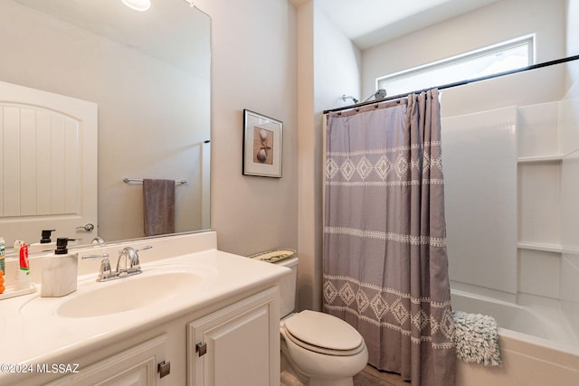 full bathroom with vanity, toilet, and shower / bathtub combination with curtain