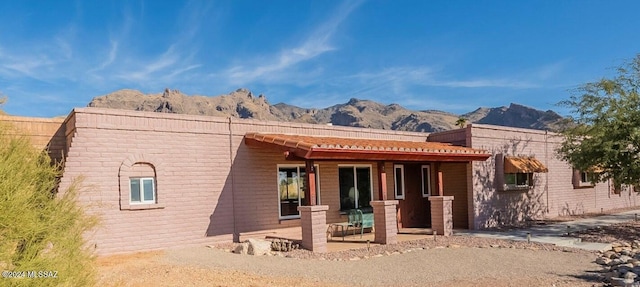 back of house featuring a mountain view