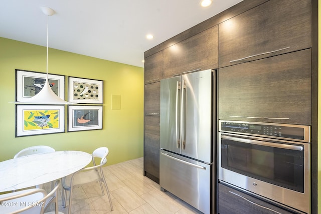 kitchen featuring decorative light fixtures and appliances with stainless steel finishes