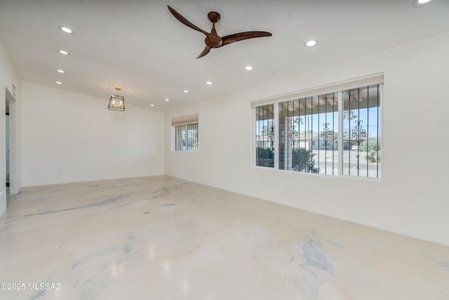 unfurnished room featuring ceiling fan