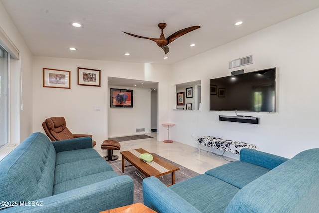 living room with ceiling fan and lofted ceiling