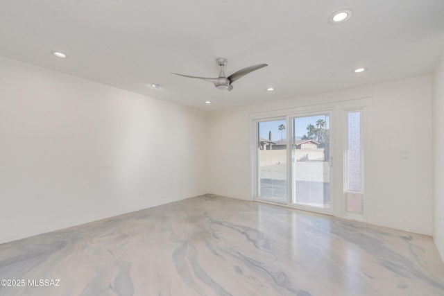 spare room with ceiling fan