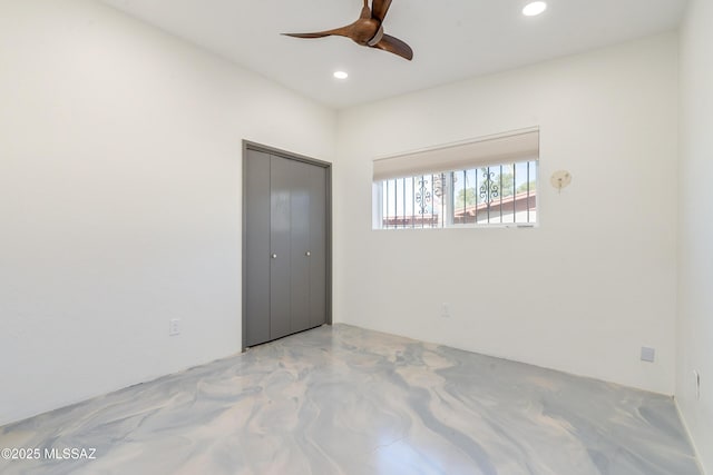 unfurnished room with ceiling fan