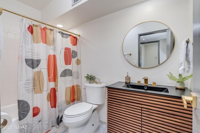 full bathroom with sink, shower / bath combination with curtain, and toilet