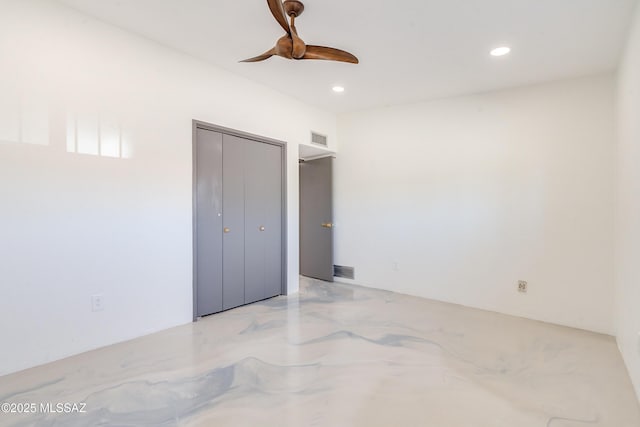 bedroom with ceiling fan and a closet