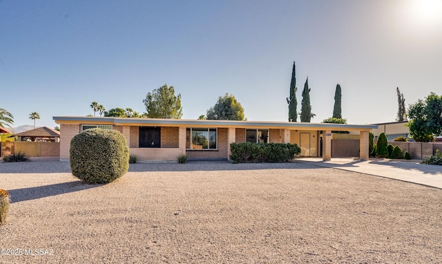 ranch-style house featuring a carport