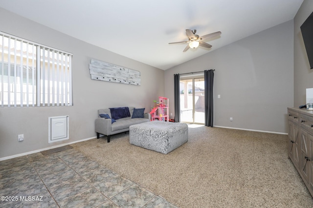 living room with ceiling fan and vaulted ceiling