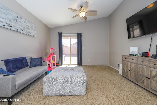 living room with ceiling fan, carpet floors, and lofted ceiling