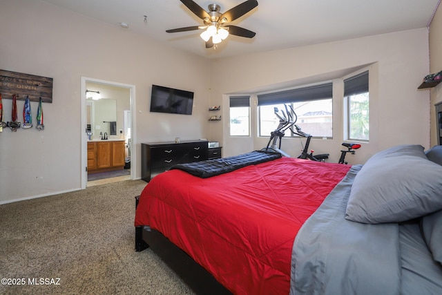 bedroom featuring carpet flooring, ceiling fan, and connected bathroom