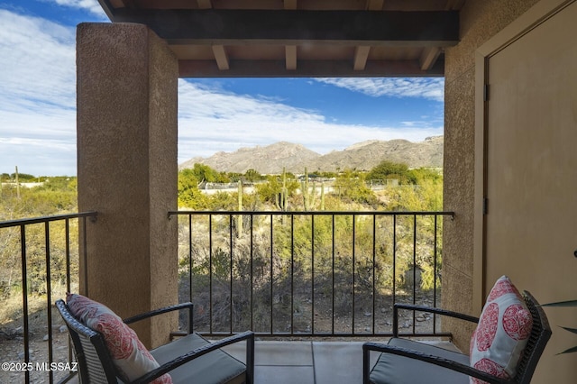 balcony featuring a mountain view