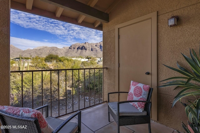 balcony featuring a mountain view