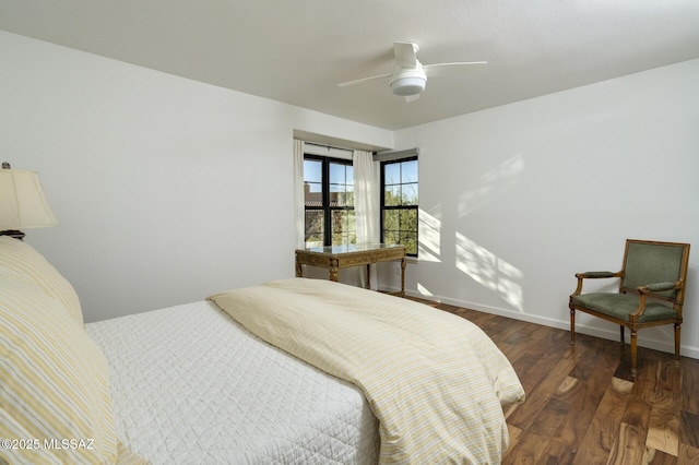 bedroom featuring ceiling fan and dark wood-type flooring