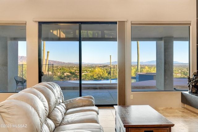 entryway with a mountain view and a healthy amount of sunlight