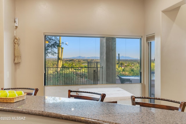 unfurnished dining area with a mountain view