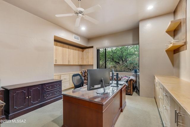 carpeted office with ceiling fan