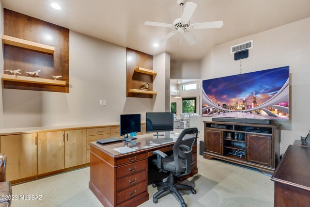 office area with ceiling fan and light carpet