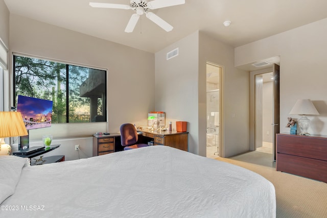 carpeted bedroom featuring ensuite bath and ceiling fan