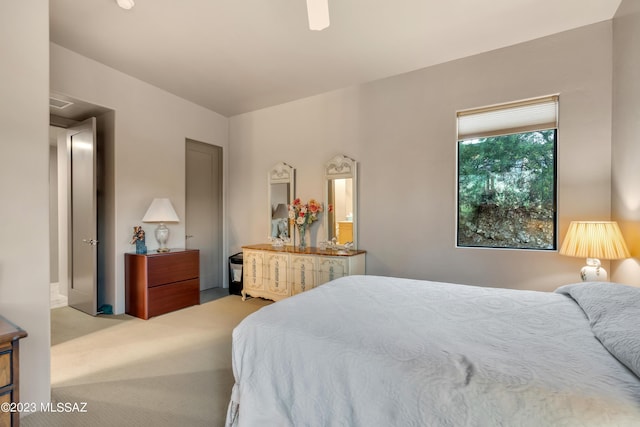 bedroom with ceiling fan and carpet