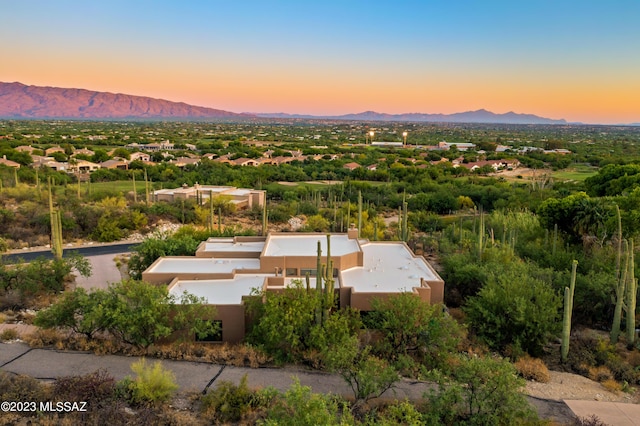 aerial view at dusk with a mountain view