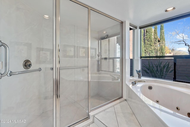 bathroom featuring independent shower and bath and tile patterned flooring