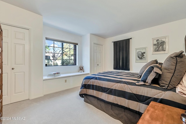 bedroom with light colored carpet