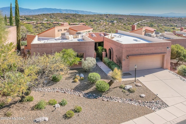 birds eye view of property featuring a mountain view