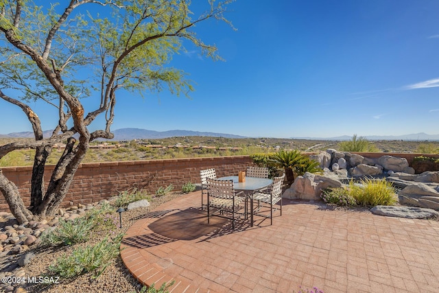 view of patio / terrace featuring a mountain view