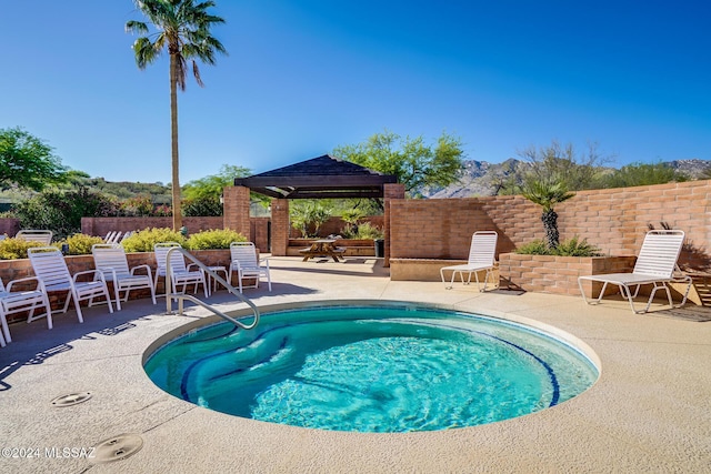 view of pool featuring a patio area and a gazebo