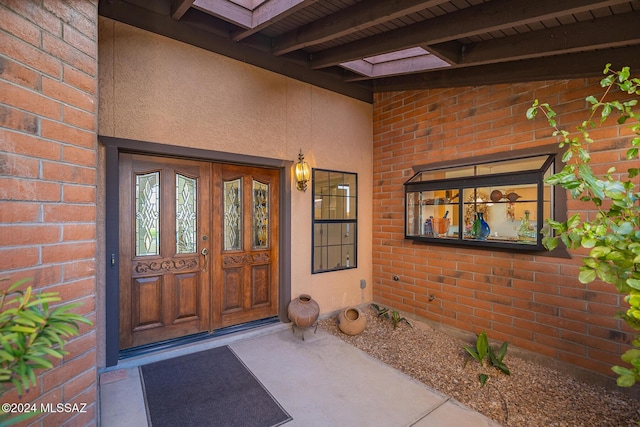 view of exterior entry featuring french doors