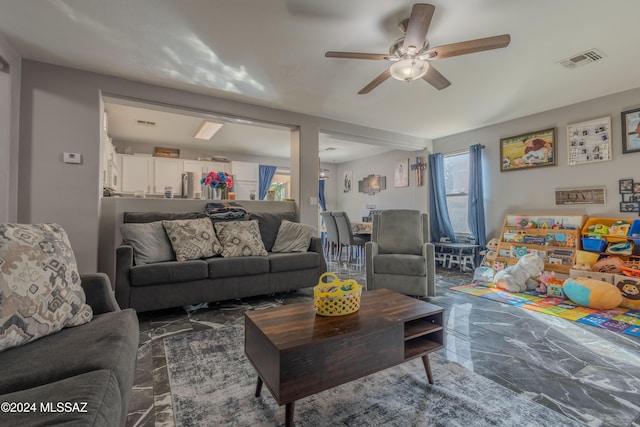 living room with ceiling fan