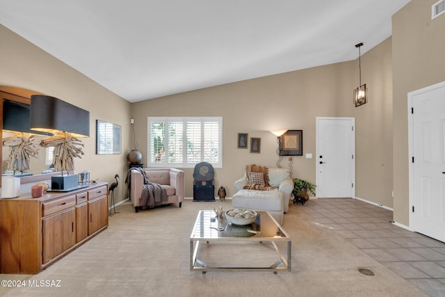 tiled living room with vaulted ceiling