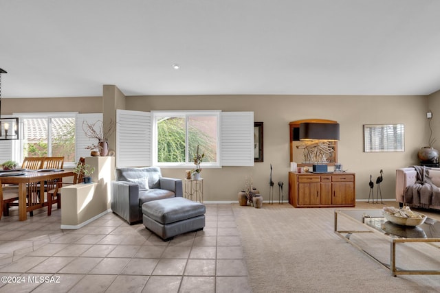 tiled living room with plenty of natural light