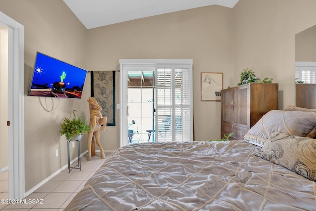 tiled bedroom with lofted ceiling