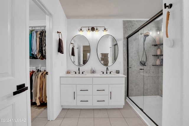 bathroom featuring tile patterned flooring, vanity, and an enclosed shower