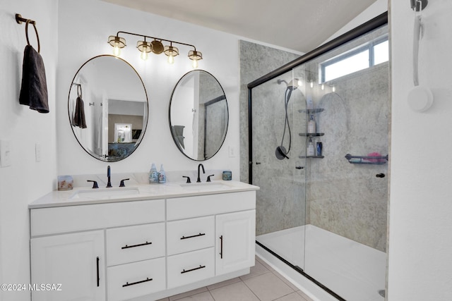 bathroom with tile patterned flooring, vanity, and an enclosed shower