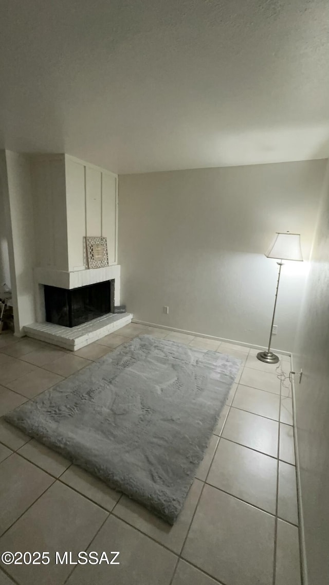 unfurnished living room with light tile patterned floors